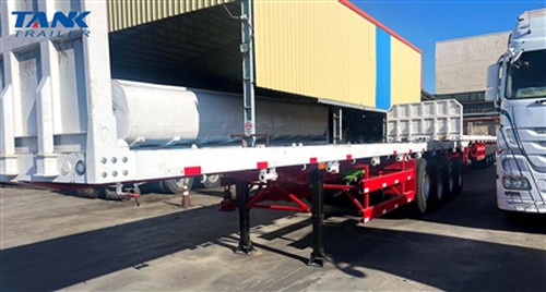 Egyptian Customer Receives Custom TANK Flatbed Semi-Trailer With Stakes, Enha...